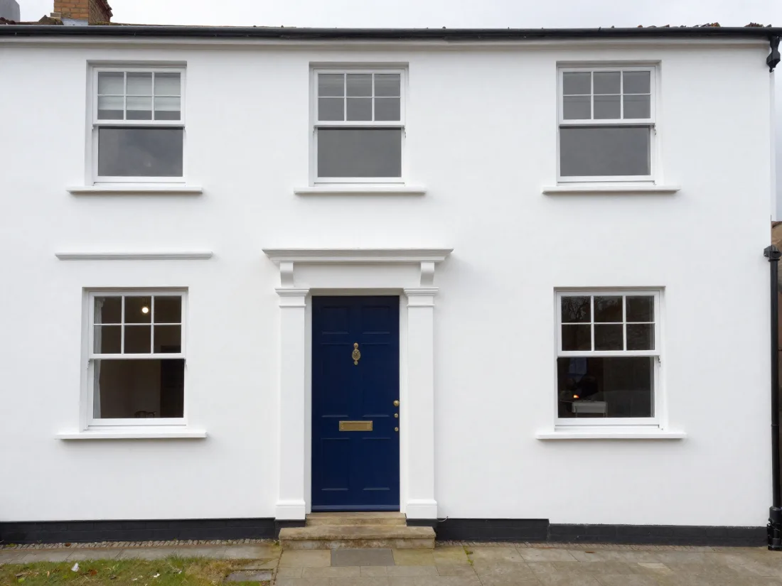 Freshly painted white exterior of a modern home